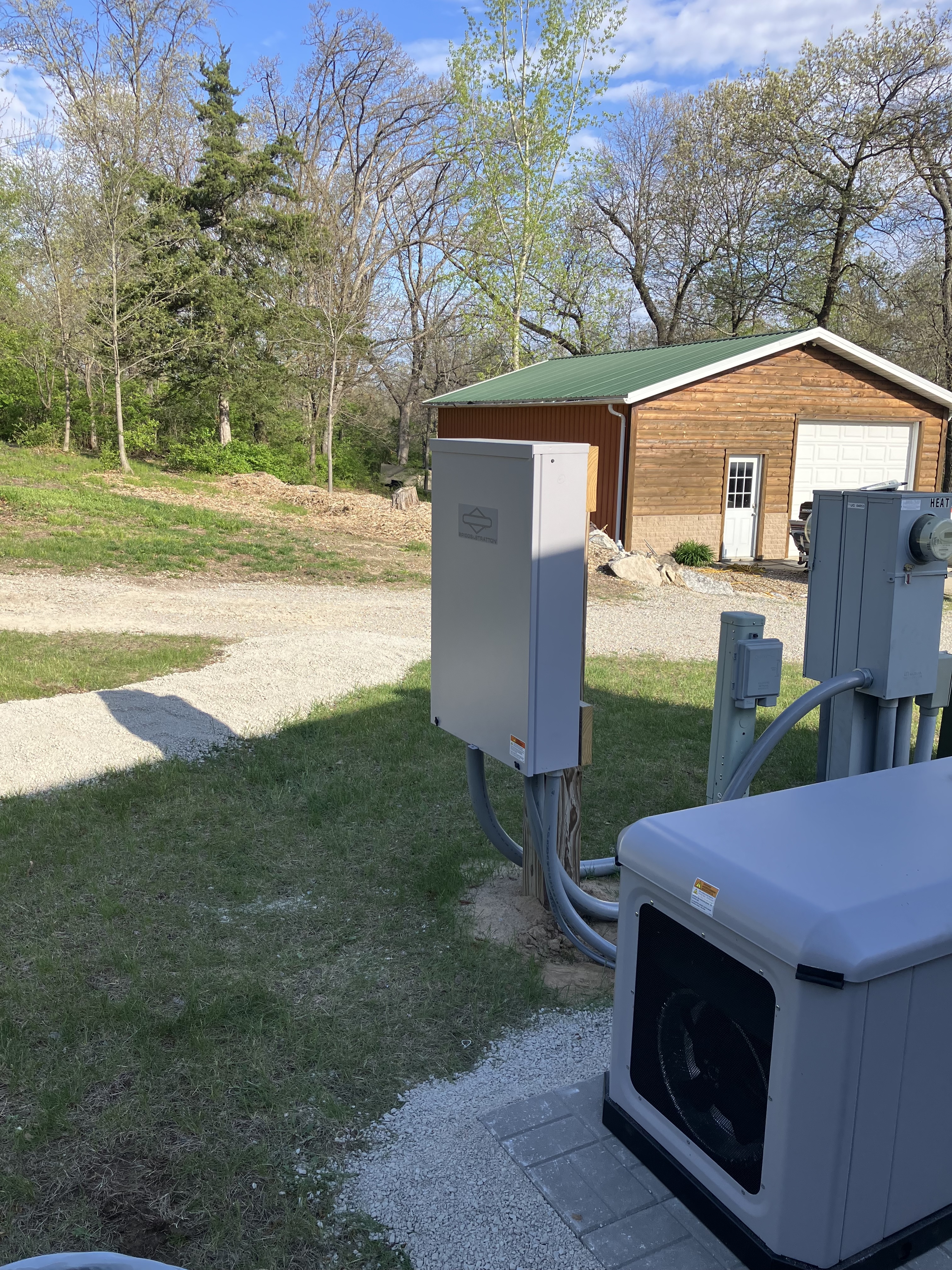 Benton County Iowa equipment and generator beside outbuilding